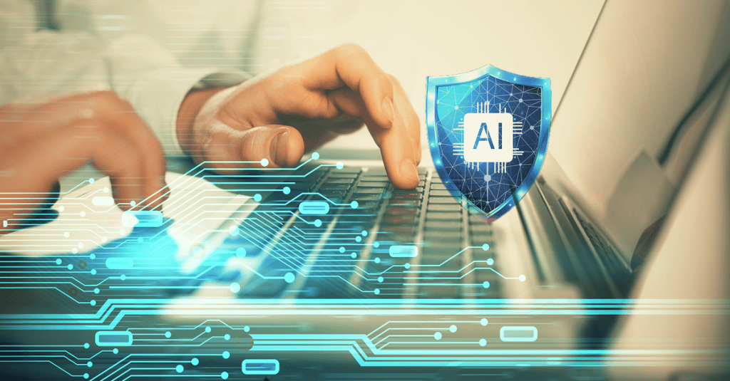 A close-up of hands typing on a laptop keyboard, overlaid with glowing teal circuit graphics. A blue shield icon with a microchip and the letters “AI” appears near the keyboard, evoking artificial intelligence and cybersecurity.